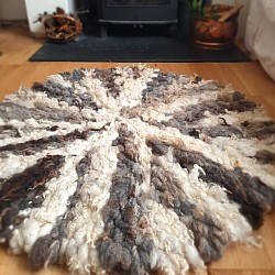 Round wool floor rug
